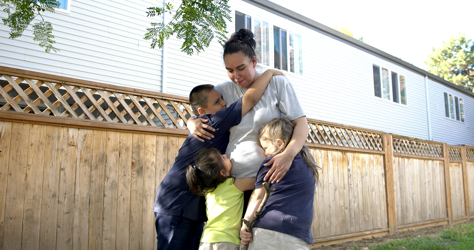 NAYA and United Way beneficiary Happy Star hugging her family