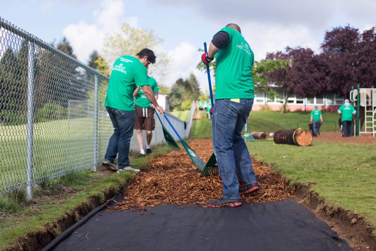 Volunteers create a new walking path at Glenfair Elementary.