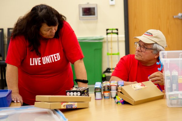 Dorila Nava talks with her husband at a STEAM event