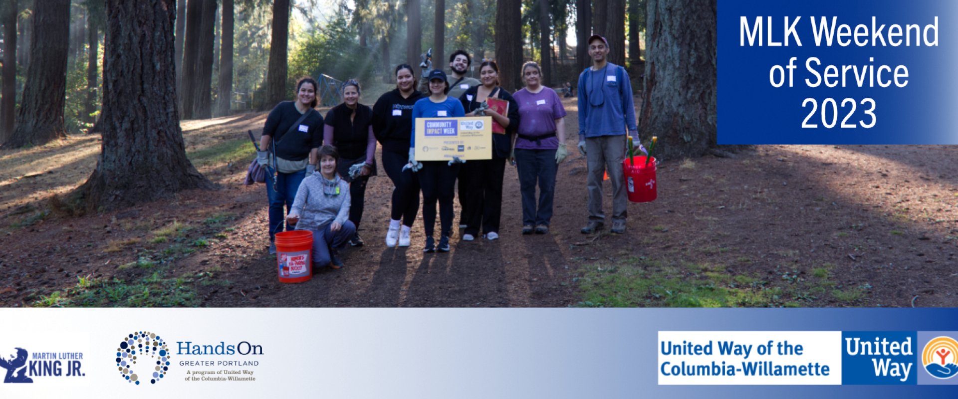 A group of volunteers pose for a photo. 