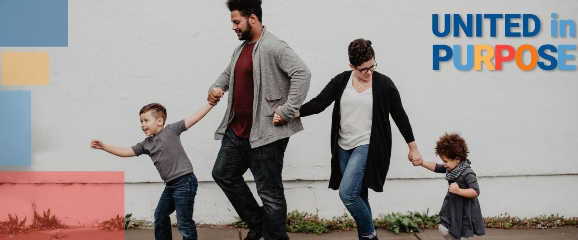 A family walks together holding hands