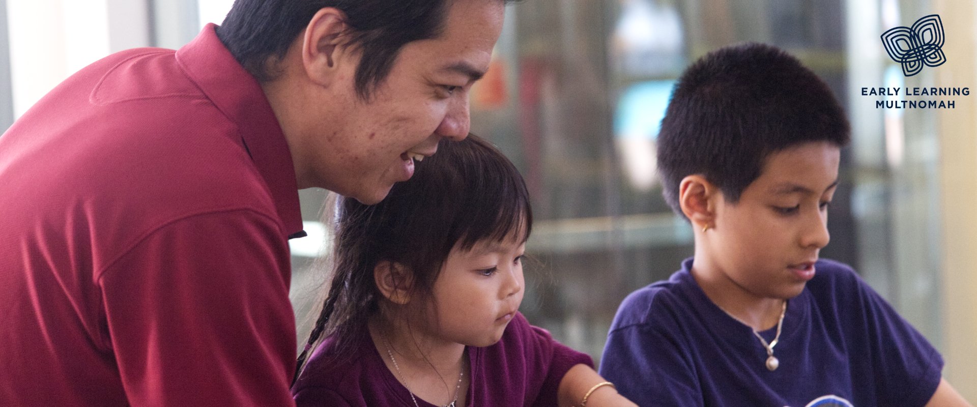 A father and his two kids work on a project