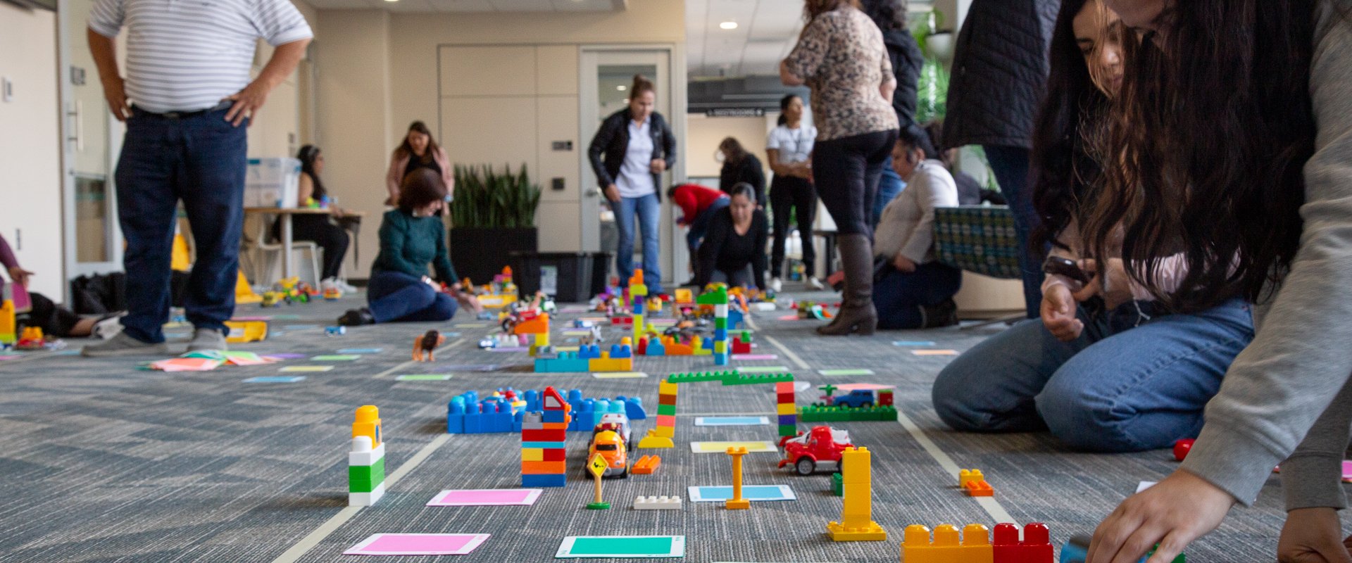 A room full of people play with toys