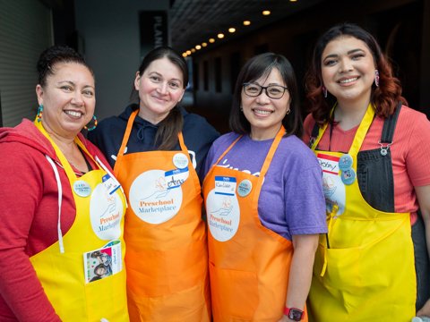 Four women smiling for the camera