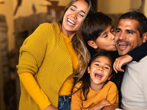 A family smiles for the camera