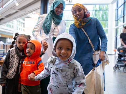 A diverse family at an event at OMSI.