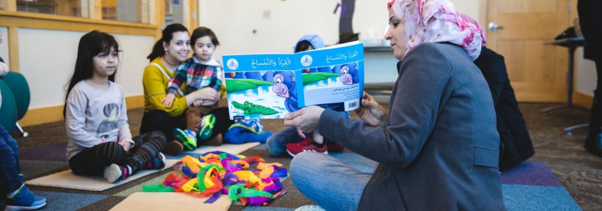 Woman reading to children
