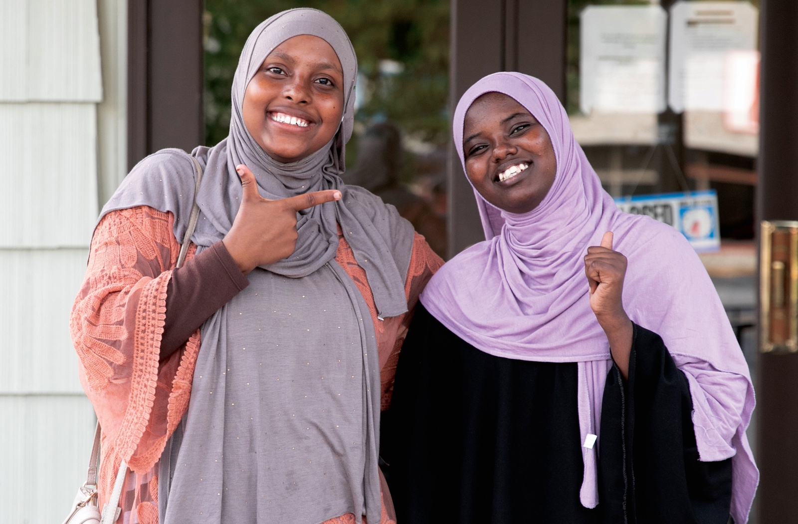 Two cheerful young women in a casual portrait photo